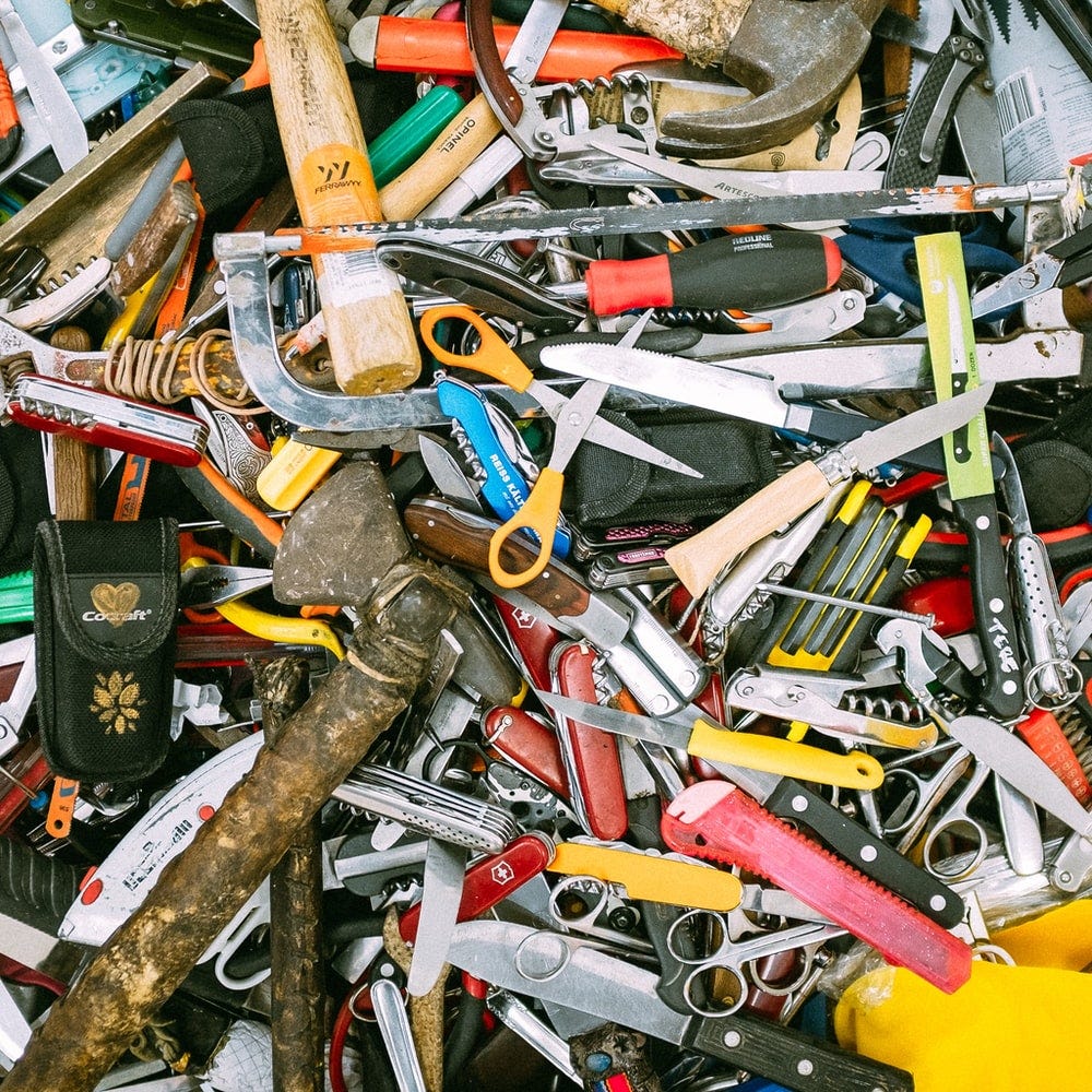 a cluttered pile of tools