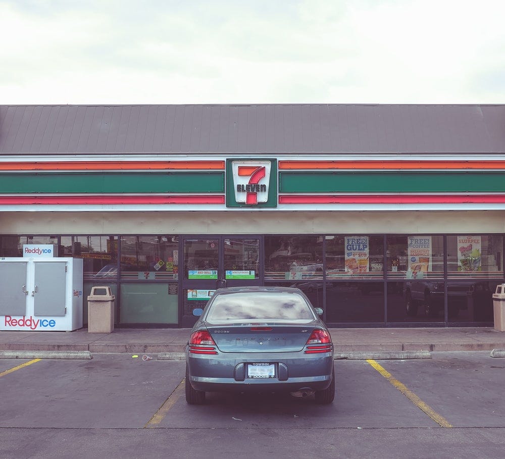 one car parked outside a 7–11