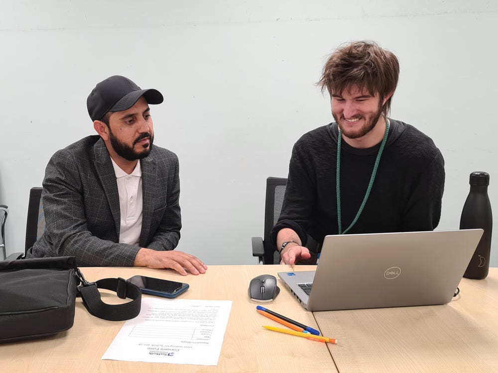 A male moderator smiles as he goes through the usability testing format.