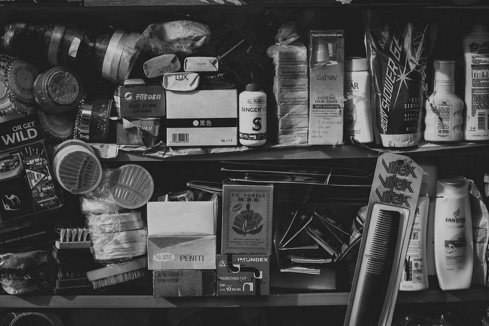 Black and white photo of messy shelves