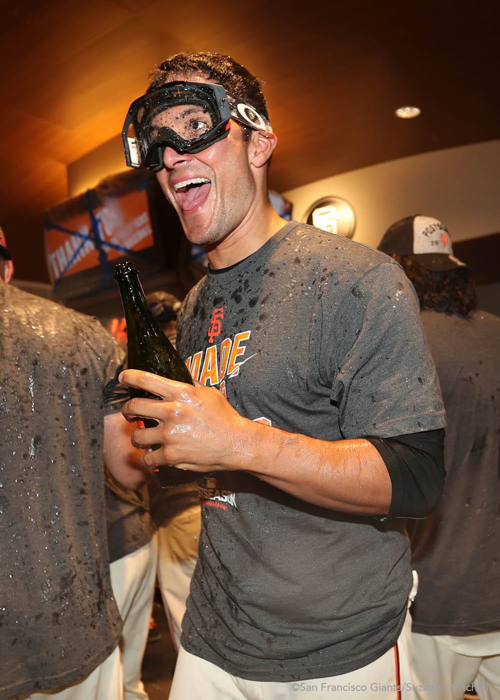 Javier Lopez celebrates in the clubhouse.