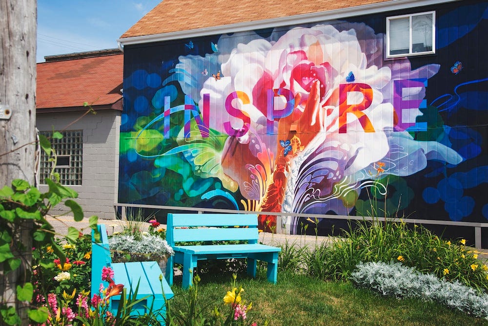A walled garden bearing the inscription ‘inspire