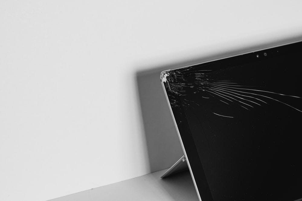 A laptop with a broken screen