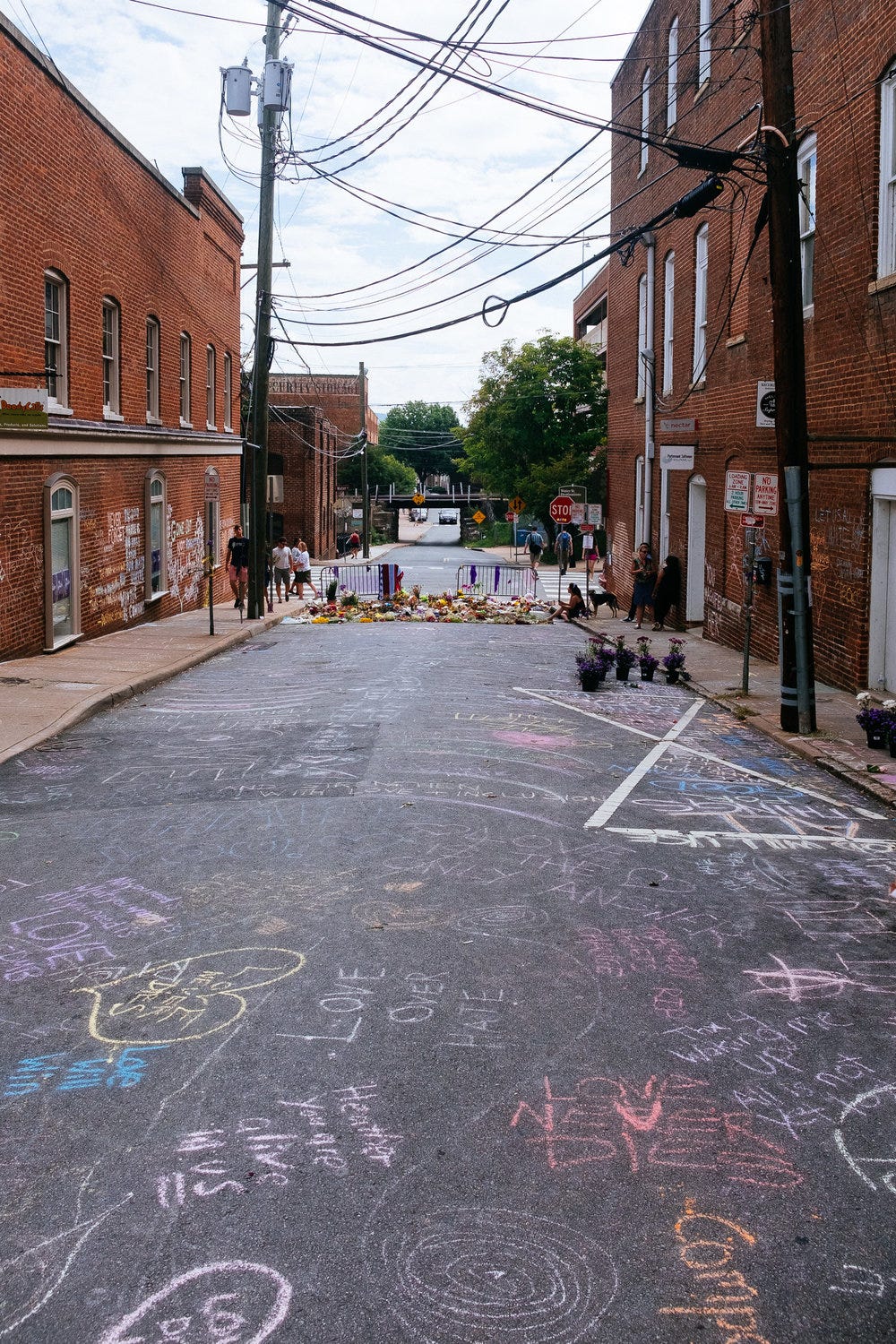 The sad scene of Heather Herrer's Death in Charlottesville, VA. We returned the next day and the rain had washed this away, but the next day another box of chalk was placed at the site. 