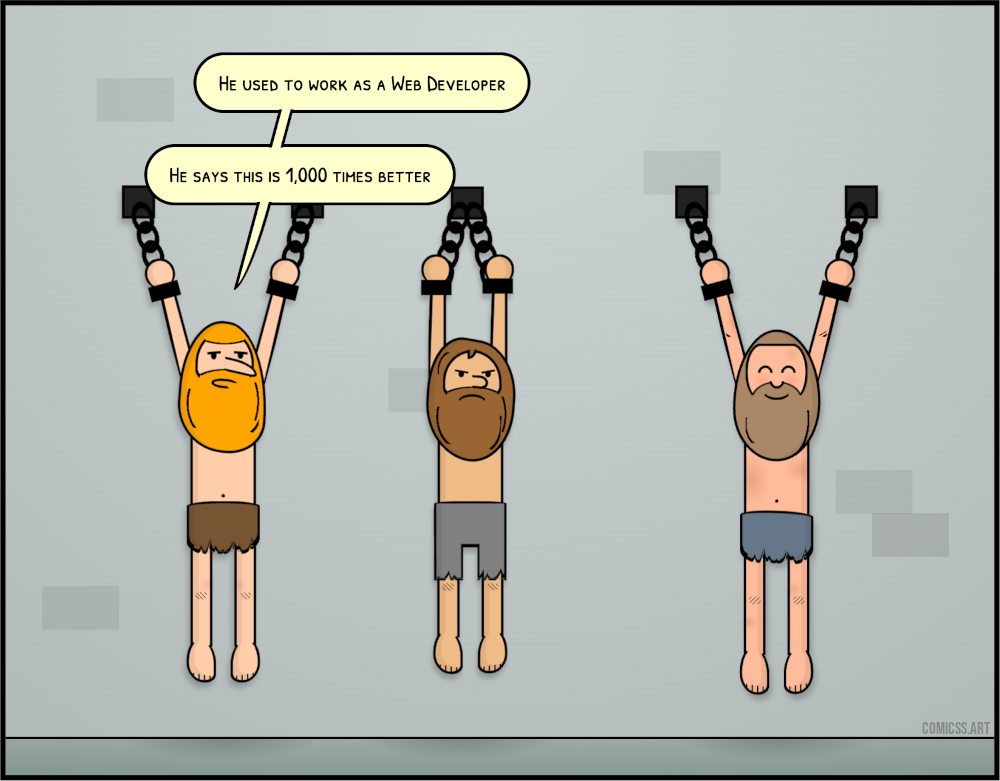 cartoon with three men hang chained in a dungeon. Two look sad, one looks happy. One of the sad ones says ‘he used to be a web developer. he says this is 1,000 times better’