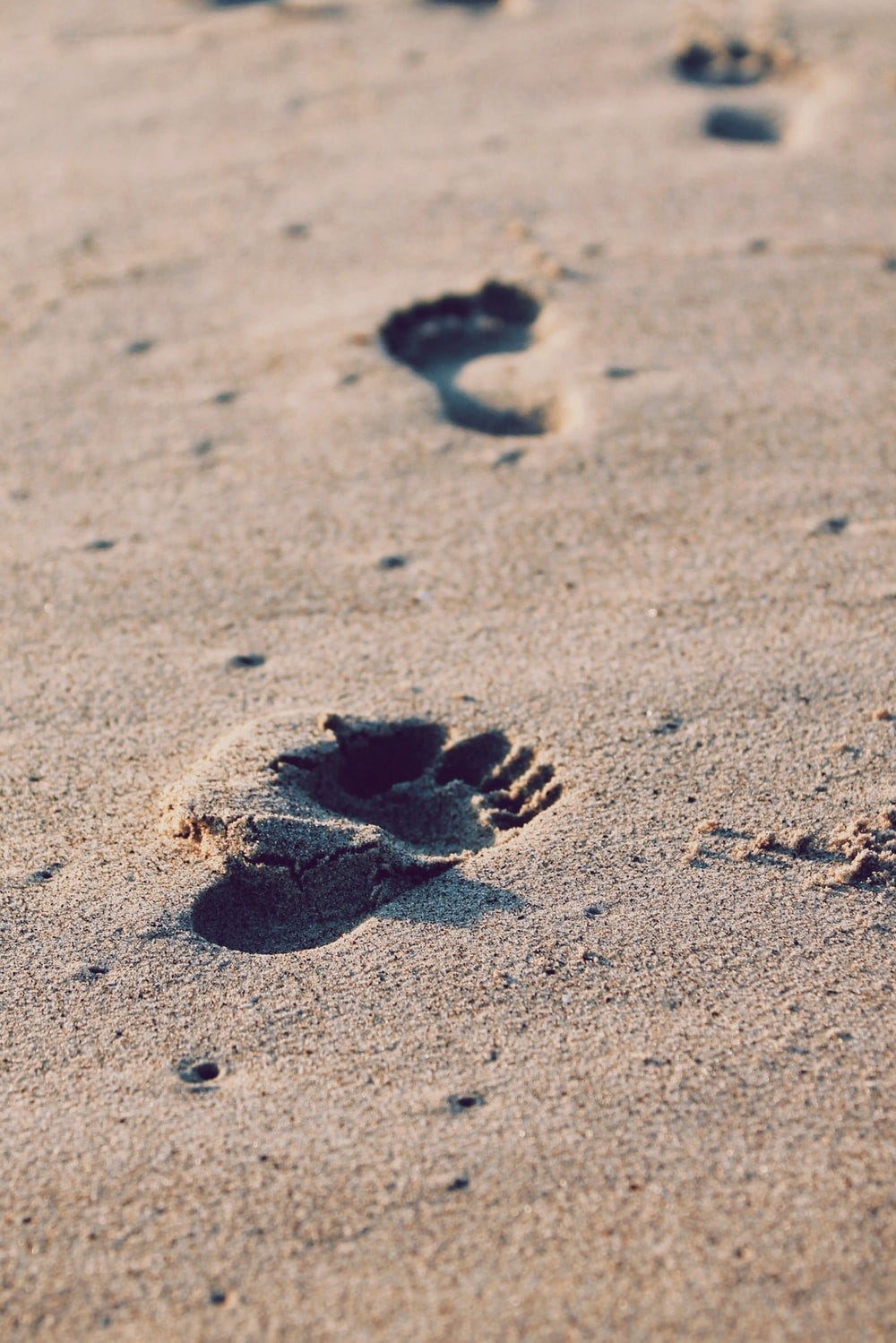 Footprints on sand.