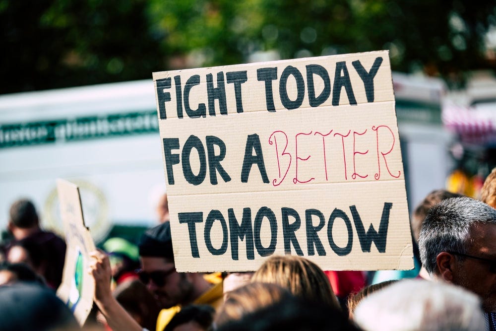 Poster with signs of FIGHT FOR A BETTER TOMORROW.