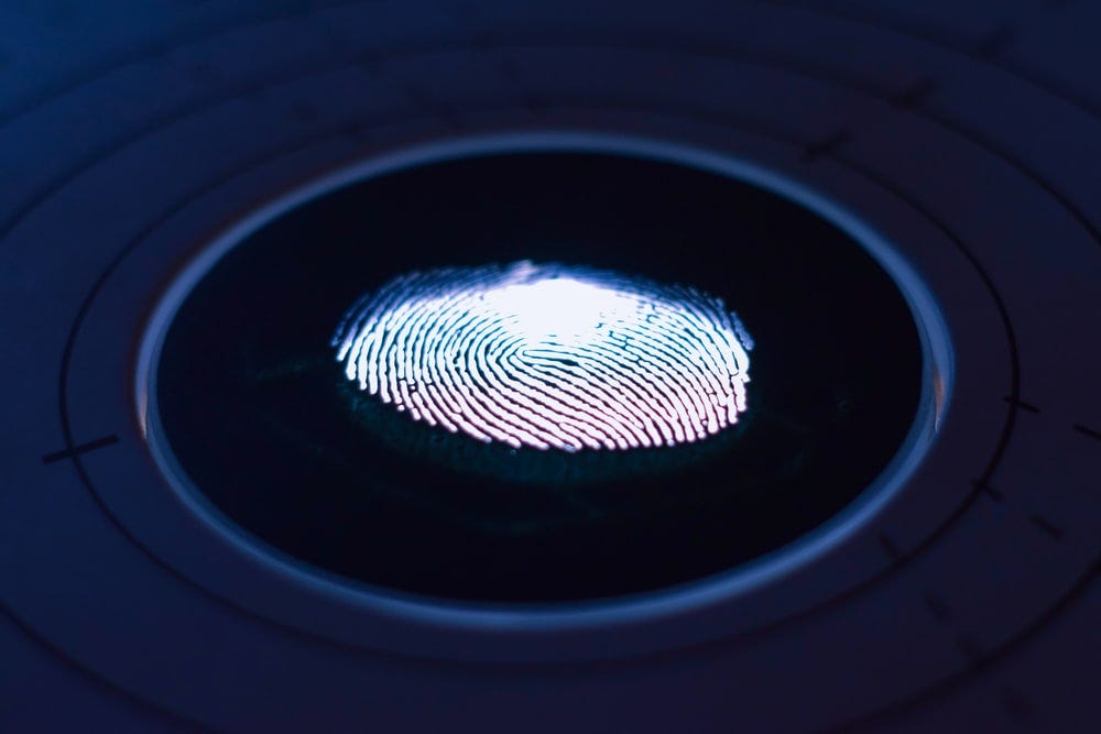 Stylised image of a fingerprint on a screen.