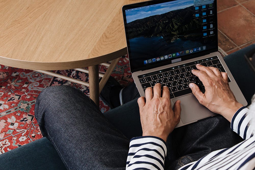 Man typing on laptop