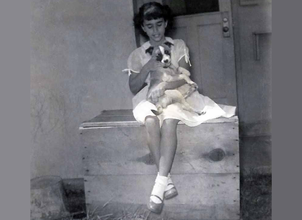 My mom with her puppy Prince in Hawaii in 1955.