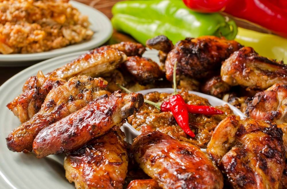 A delicious plate of chicken wings, crispy and juicy with seasonings.