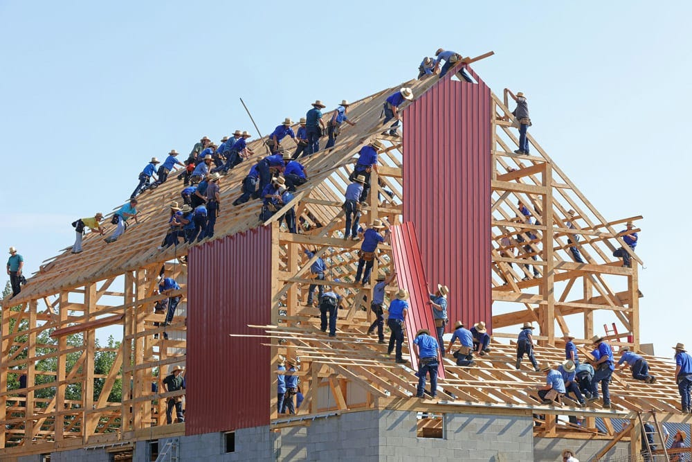 Workers building a house together