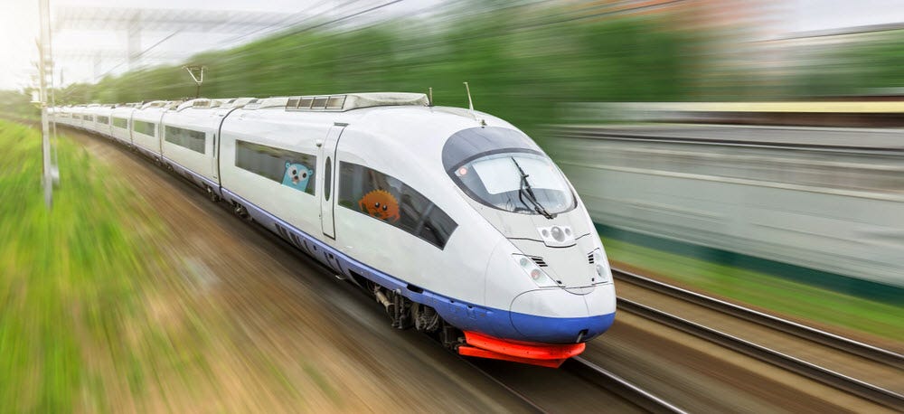 The Rust and Golang mascots riding in a bullet train