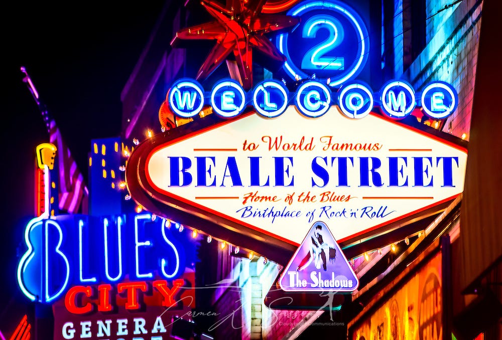 A photo of neon lights displaying “Welcome to World Famous Beale Street, Home of the Blues. Birthplace of Rock ‘N Roll”