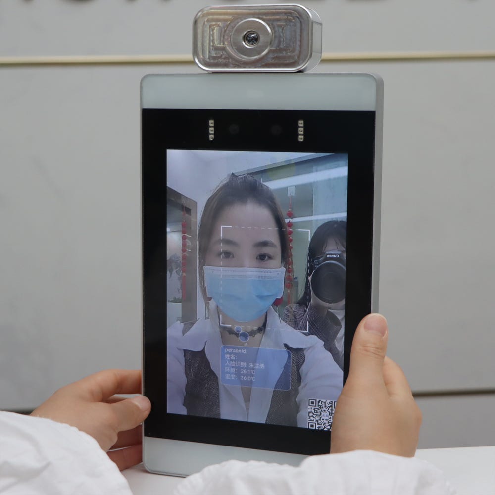 A tablet with a facial recognition based attendance system in place