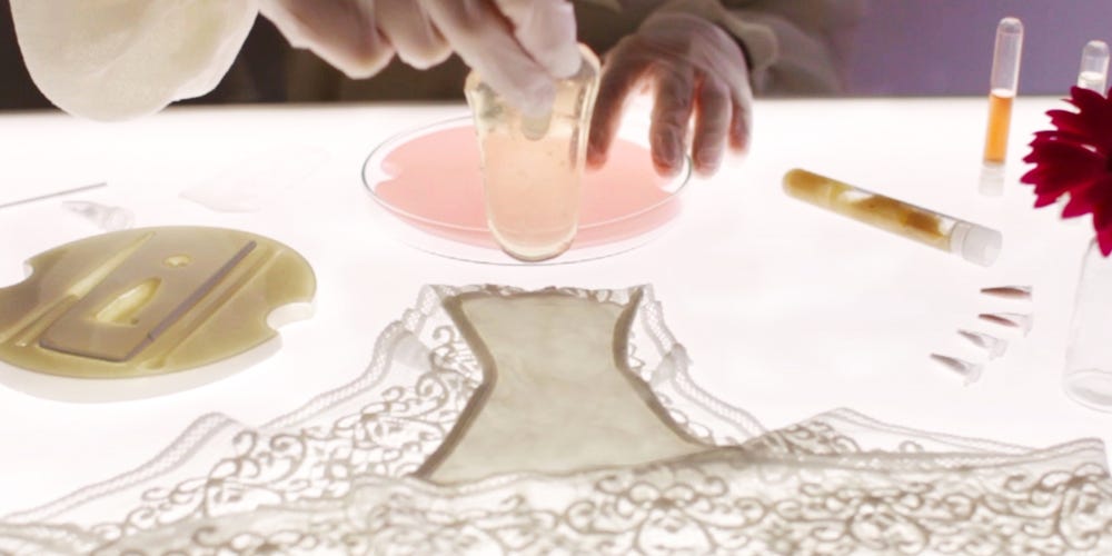 A person adding a layer of microbes onto a lady underwear