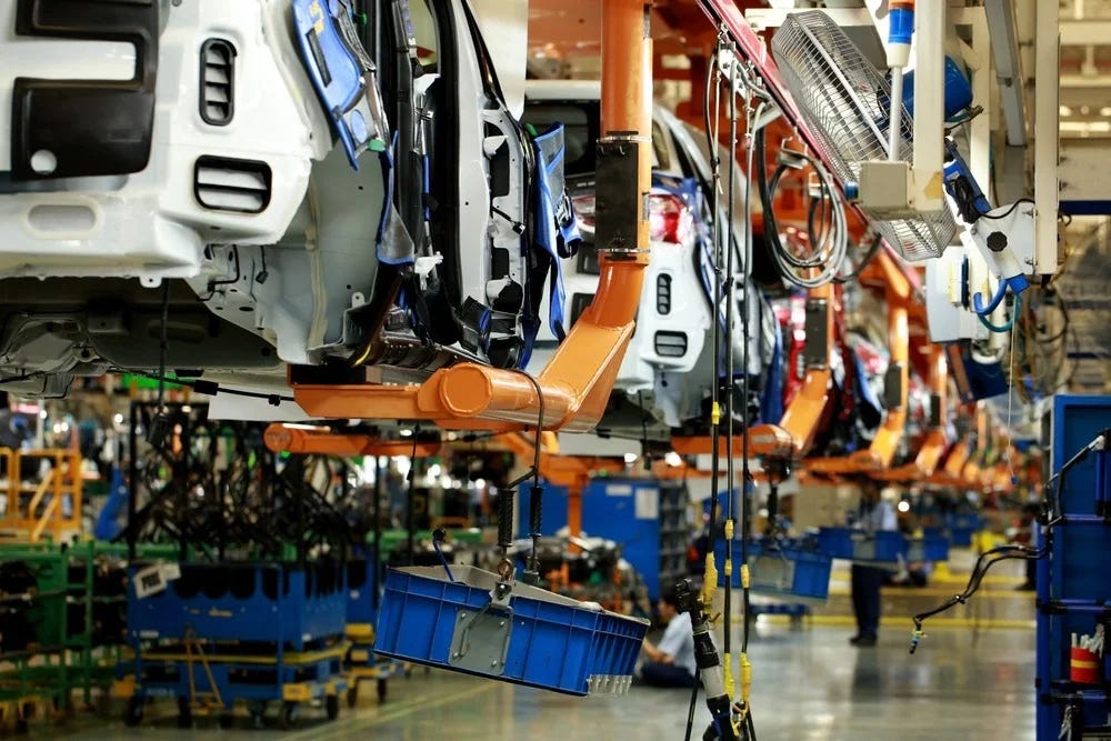 A shot of a production line inside a vehicle manufacturing plant.