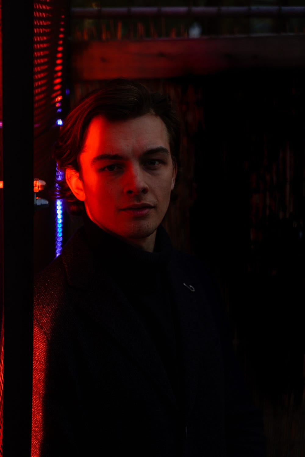 Exposure triangle is not needed to create a picture like that. A portrait of a man with red light