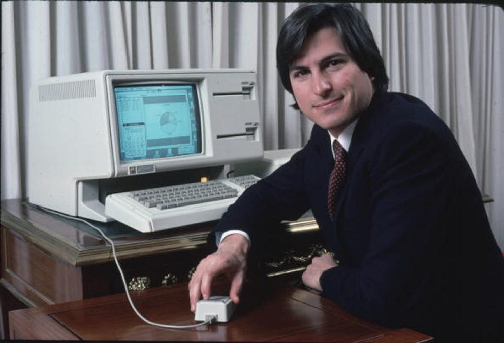 Steve Jobs with the Apple Lisa computer in 1983