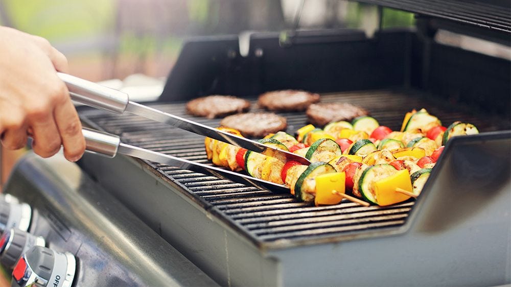 Grilling hamburgers and vegetables