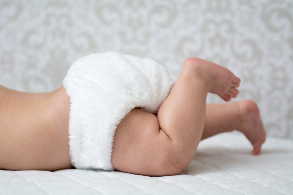 Picture of the lower part of a baby wearing a nappy