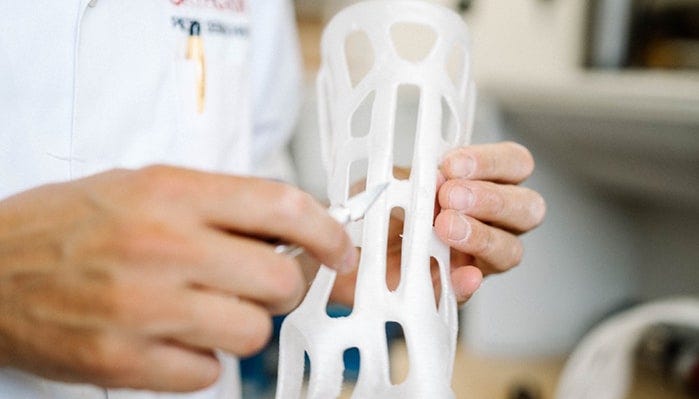 Trimming (Image courtesy: Custom made orthoses printed on a 3D printer being corrected by an orthopedist by Tom Claes Licensed under Unsplash)