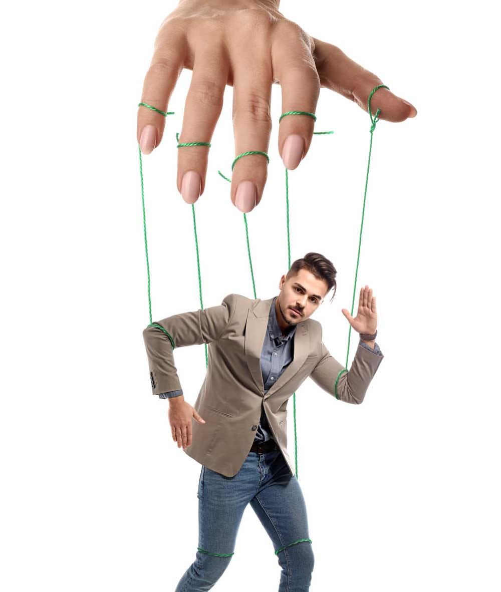 woman’s hand hold man with marionette strings