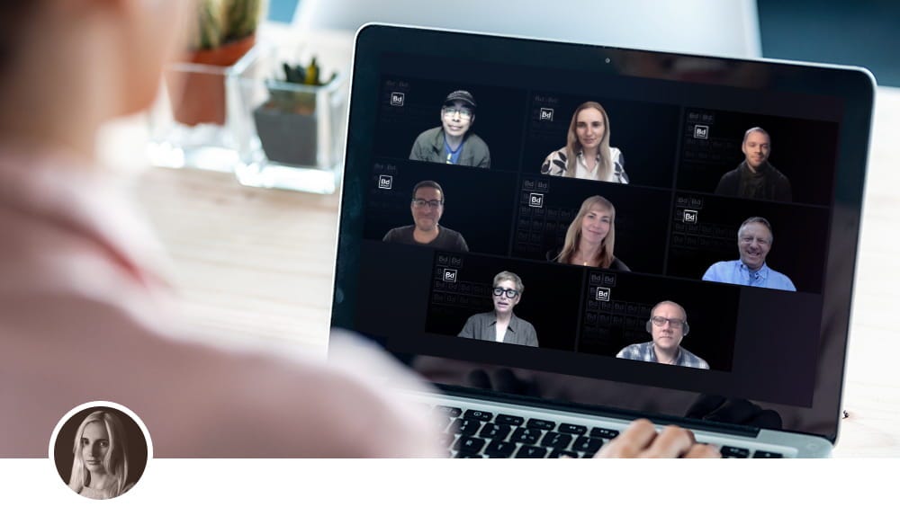 Over-the-shoulder photo of person on a video call, with the Boldium team’s faces on the screen.