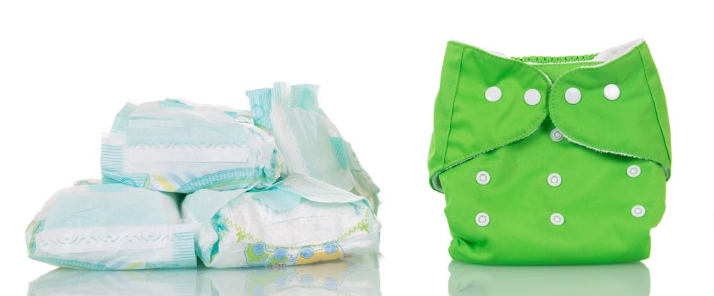 Picture of several single-use diapers and a reusable diaper