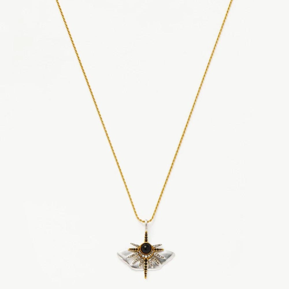 Long Gold Necklace with Big Butterfly in the Center.