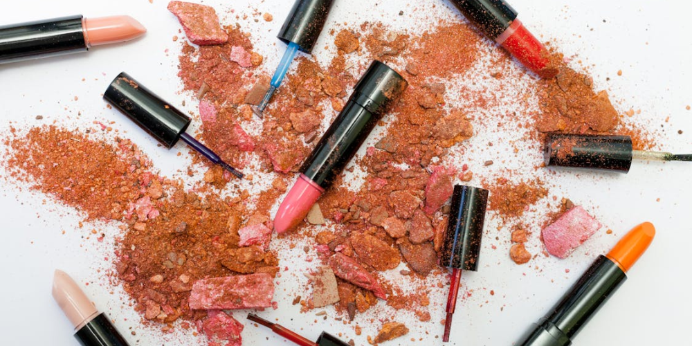 Image of a lipstick with a sleek, modern design on a neutral background. The lipstick tube is open, revealing a rich, vibrant shade of red. This image is used to illustrate the blog post ‘Toxic Ingredients in Lipstick to Avoid for Clean Beauty,’ highlighting the importance of avoiding harmful chemicals in cosmetics for healthier, cleaner beauty options.