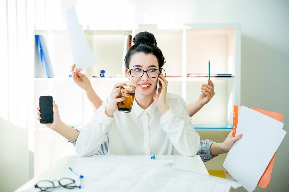 Woman in office multitasking