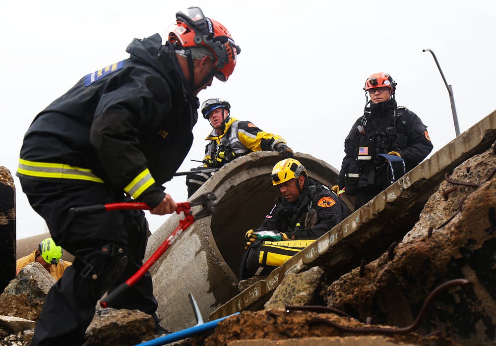 L.A. County Fire Department USAR teams work their way through concrete tunnels as they search for survivors.