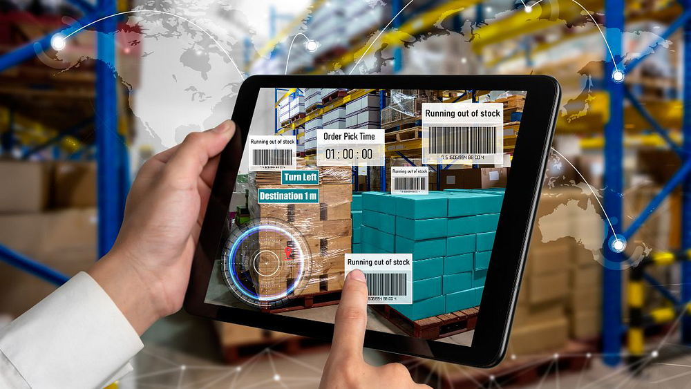 A person is showing in his tablet on ways to Use Augmented Reality in Warehouses