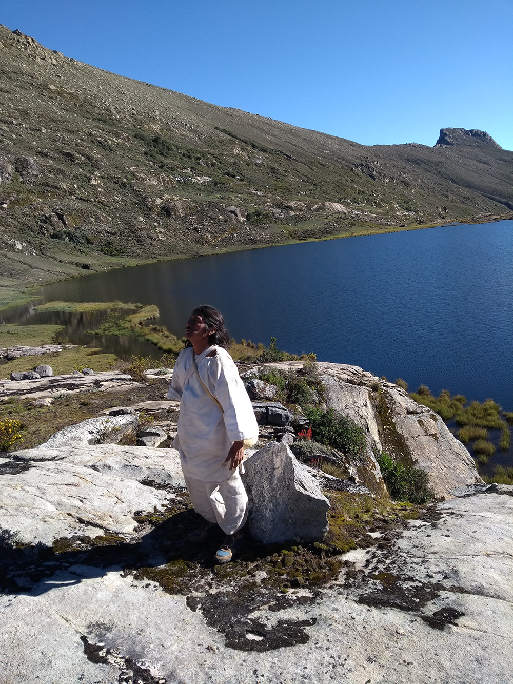 Mamo Santos Sauna Limaco in meditation along the shores of the sacred Lake Shizhiñue.