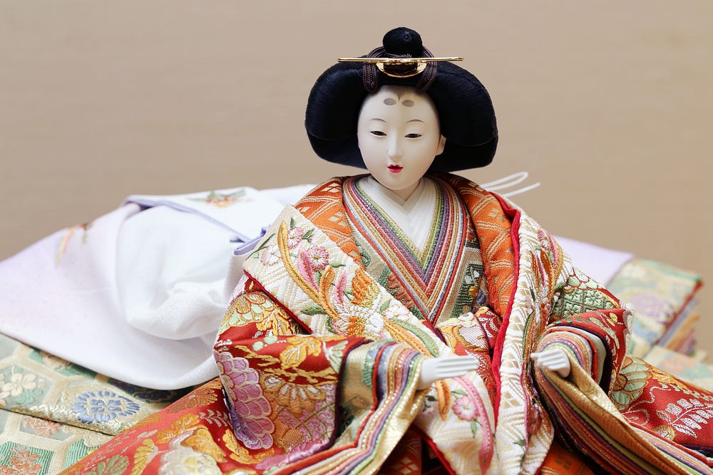 Hinamatsuri empress doll in layers of silk kimono.