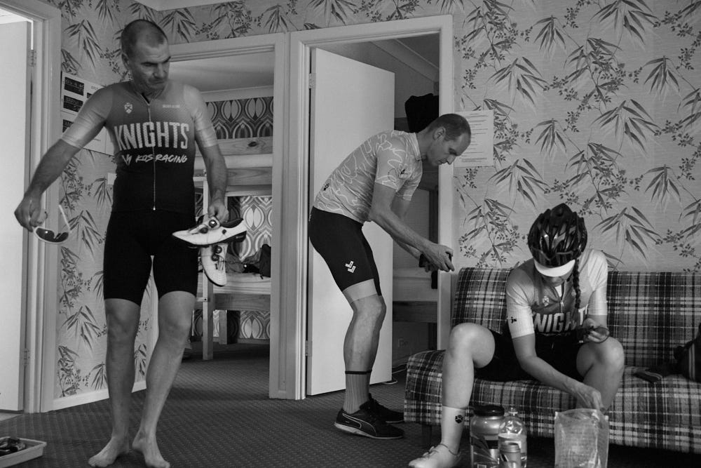 three people in a lounge room getting ready to cycle.