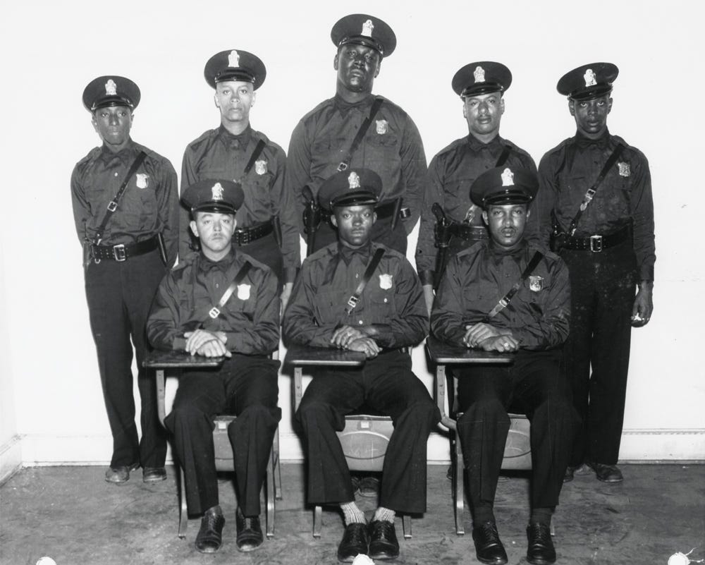 The first eight African American officers in the Atlanta Police Department. From left, front: Henry Hooks, Claude Dixon, Ernest H. Lyons; back: Robert McKibbens, Willard Strickland, Willie T. Elkins, Johnnie P. Jones, and John Sanders. (Photograph courtesy of Kenan Research Center at the Atlanta History Center)