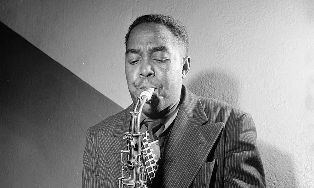 A black and white image of Charlie Parker playing the saxophone