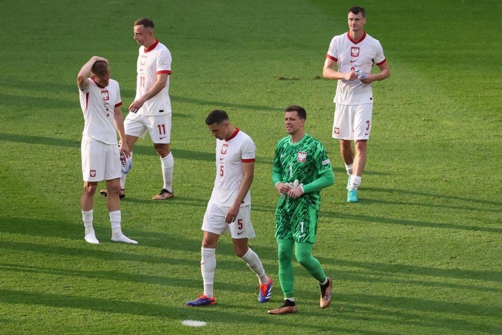 photo of Poland players looking sad