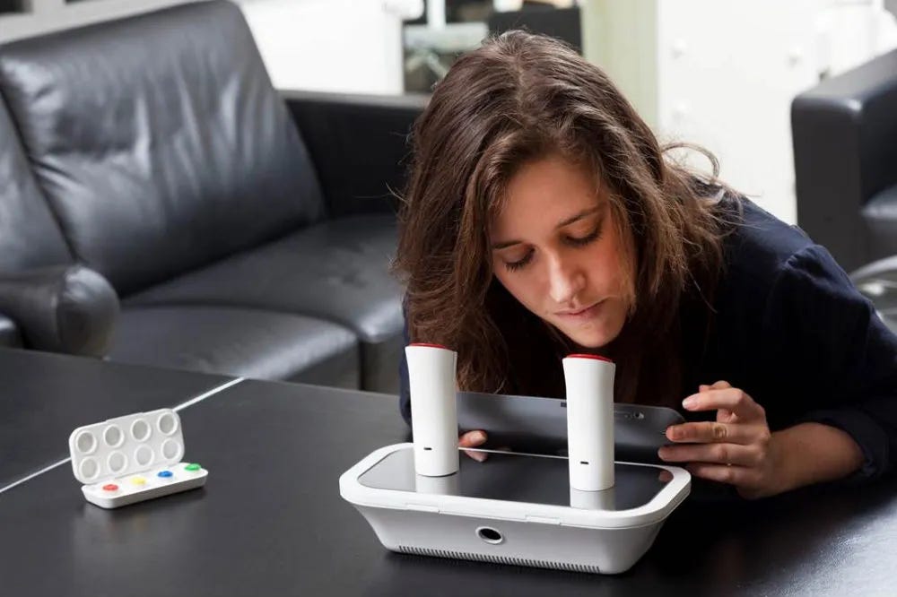 Co-founder Rachel Field using the oPhone DUO to test out the digital aroma.