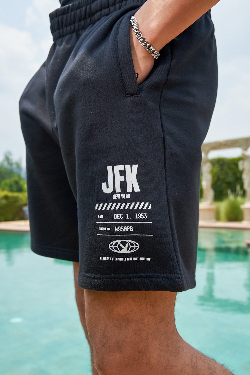 Comfortable sweat shorts with JFK emblemfrom a brand called Bonkers Corner, great for relaxing or hitting the gym.