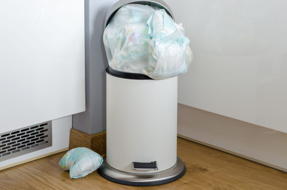 Picture of a bin overloaded with single-use diapers