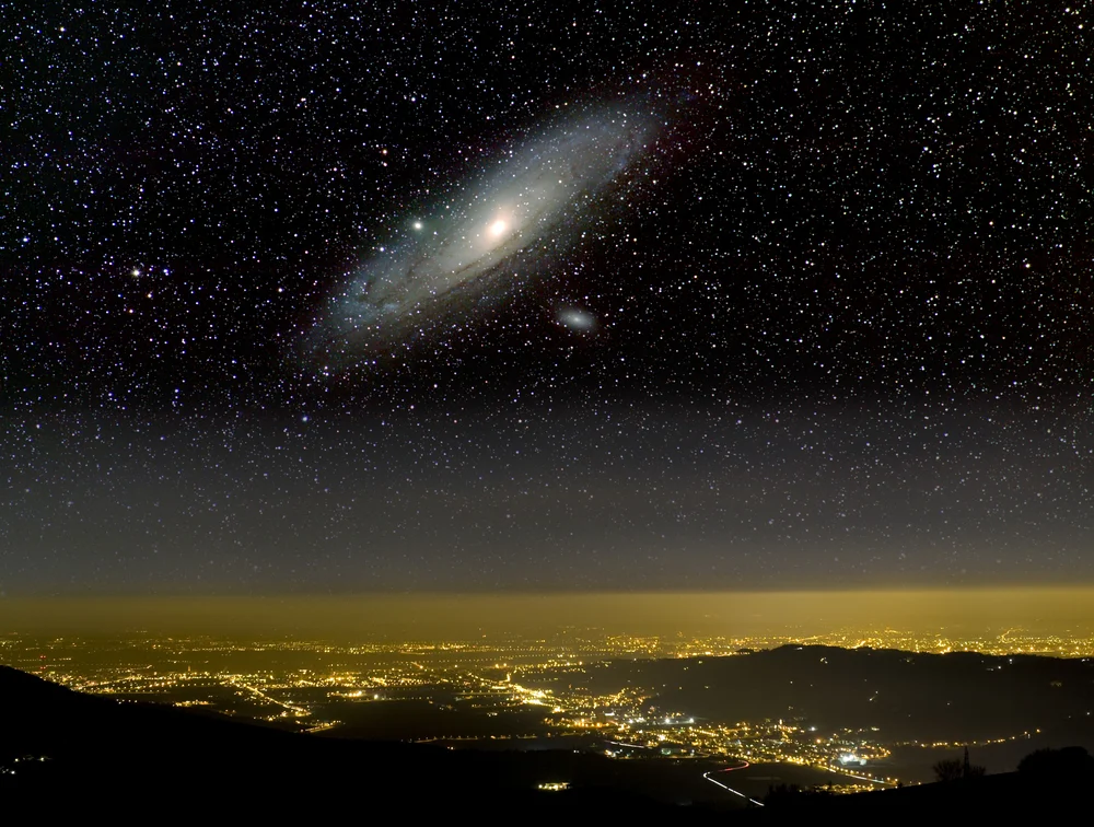 Does the collision of the Milky Way and Andromeda pose a danger to hum