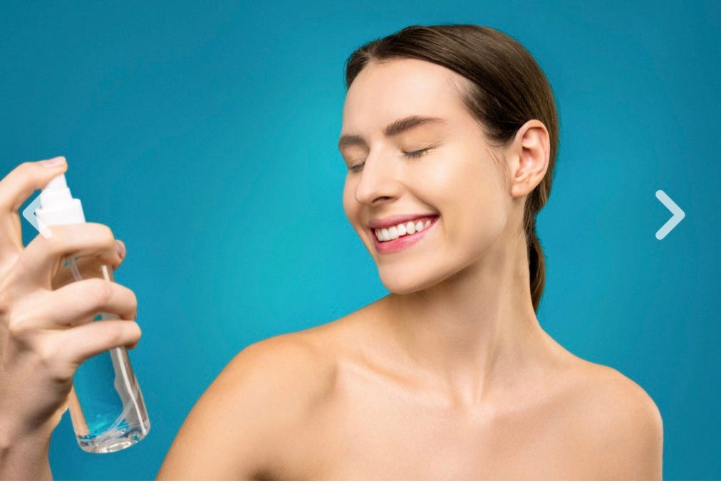 A woman holding a skincare beauty product. salicylic acid