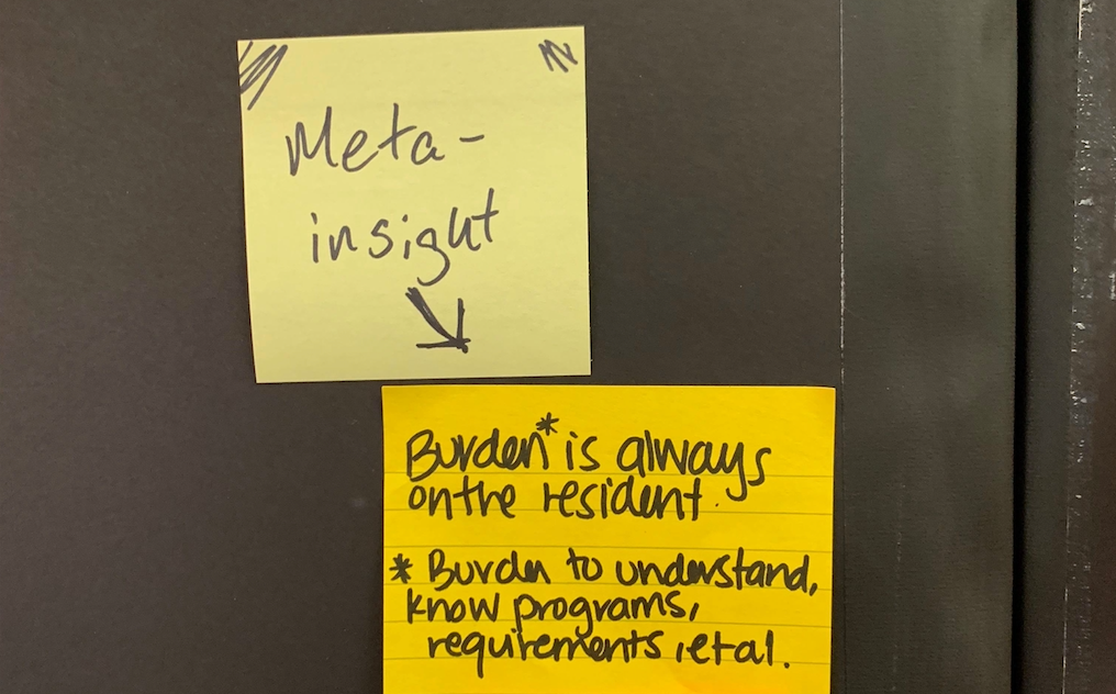 Sticky note with the “burden is always on the resident — burden to understand, know programs, requirements, et. ” text on it.