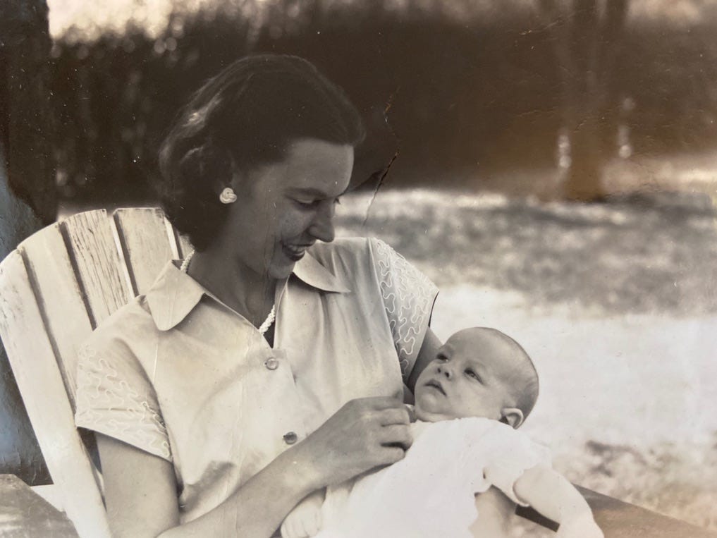 My grandmother holding her son, my father.