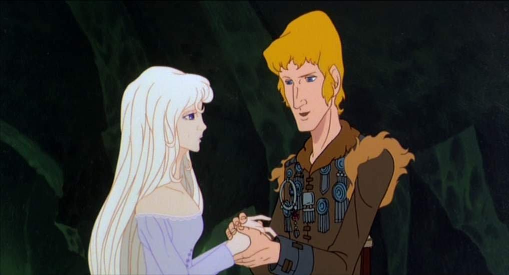 Image: Prince Lír holds Lady Amalthea’s hand in the 1982 Rankin and Bass movie The Last Unicorn.