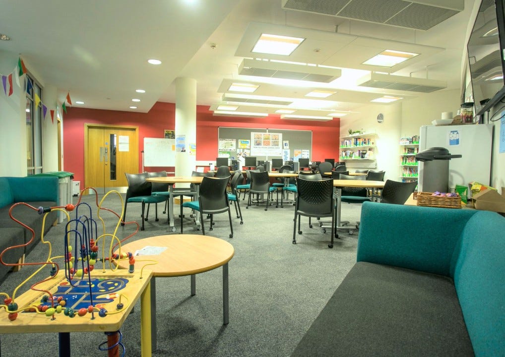 An image of the whole of the LLC Resource Area, with a children’s play area and a refreshment area in the foreground.