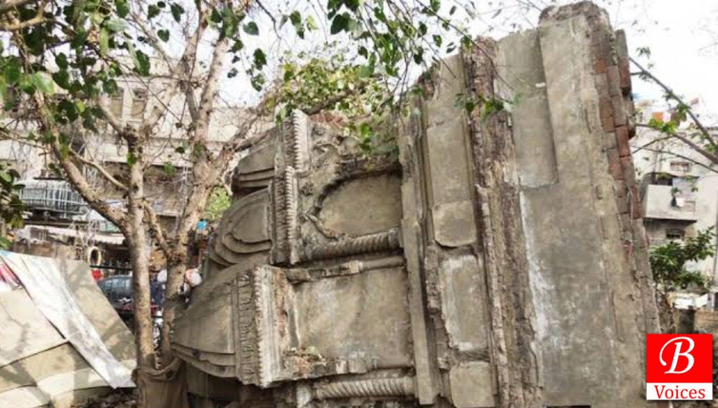 A view of the Jain mandir wall removed and placed sideways on the road to make way for the train track construction work